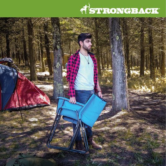 Photo of man in woods walking with a STRONGBACK blue director chair