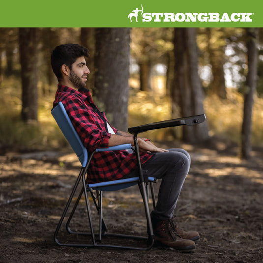 Photo of man in woods sitting STRONGBACK BLUE director chair