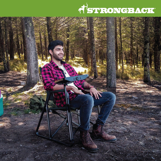 Photo of man in woods sitting in STRONGBACK black director chair